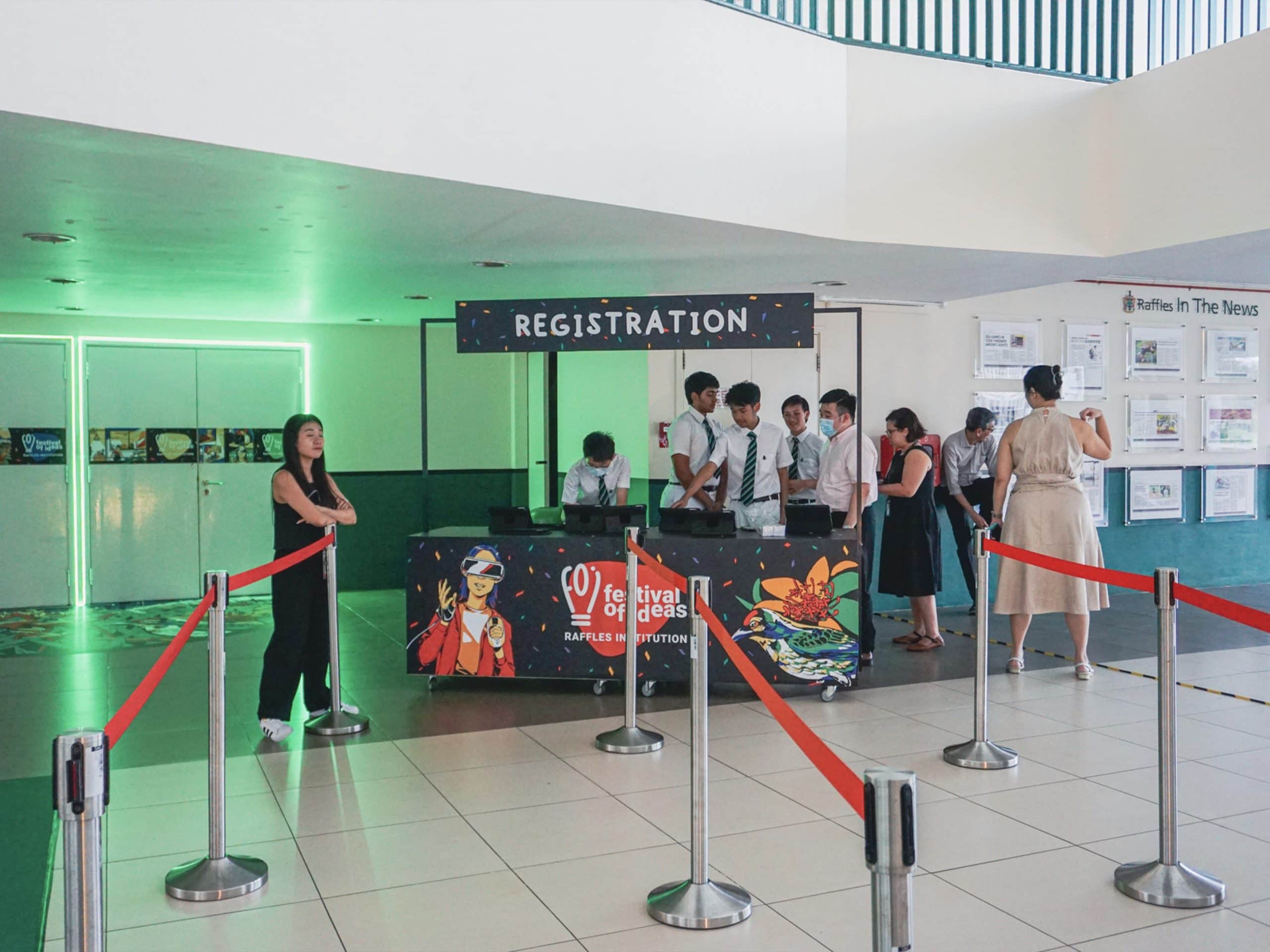 Registration desk for the Festival of Ideas event at Raffles Institution, organized by an event planner company