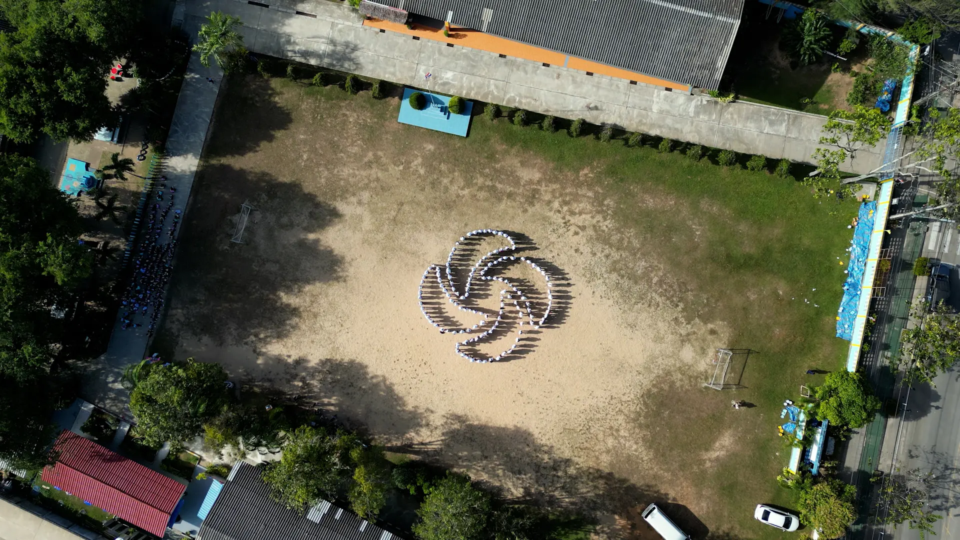 aerial-view-corporate-team-building-large-group-logo-formation