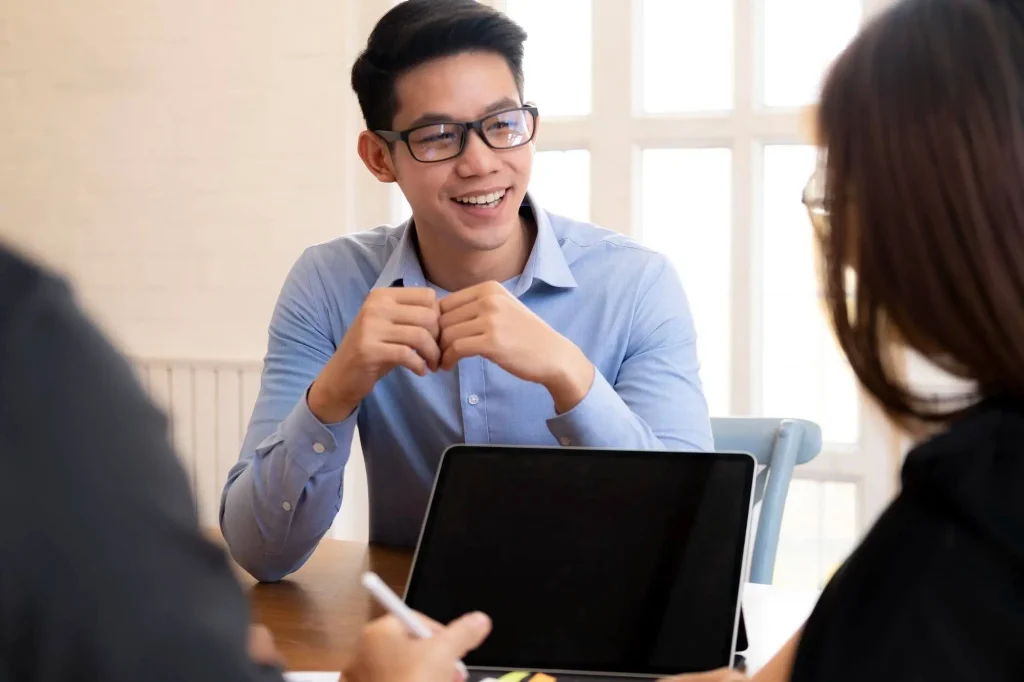 A friendly event organizer company consultant engaging with clients during a planning consultation